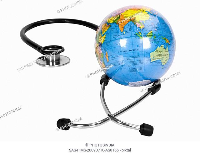 Close-up of a globe with a stethoscope