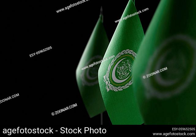 Small national flags of the Arab League on a black background