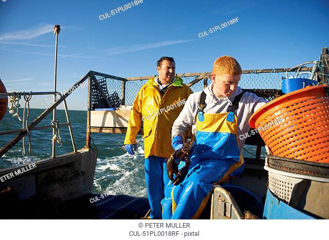 Fishermen at work on boat