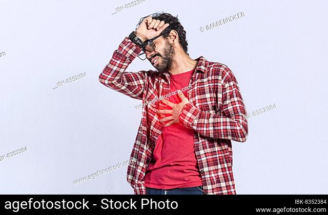 Handsome man with chest pain isolated, person with tachycardia, People with heart pain on isolated background, young man with chest pain isolated