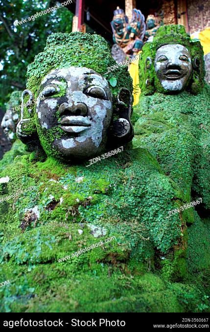 Green demons on the staircase in temple, Bali
