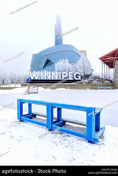 Canadian Museum for Human Rights and ice hockey rink on a frosty winter day, The Forks, Winnipeg, Manitoba, Canada