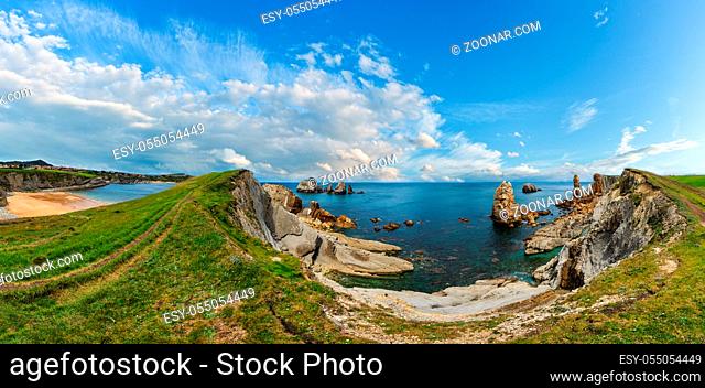 Arnia Beach (Spain) and summer Atlantic Ocean coastline landscape. Multi shots stitch high-resolution panorama