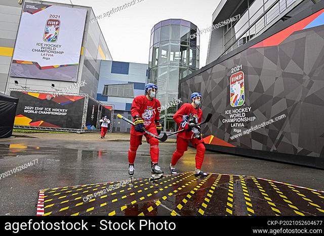 Lukas Klok, left, and Filip Chytil of Czech Republic on the way to a bus that will take them to the training hall during the 2021 IIHF Ice Hockey World...