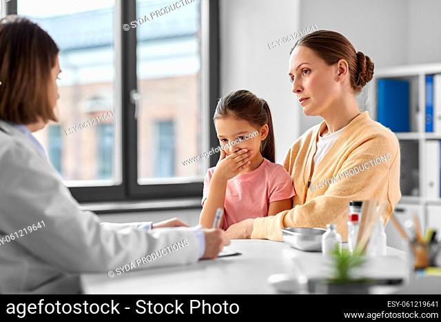mother, coughing daughter and doctor at clinic
