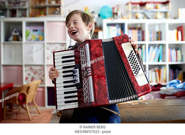 Boy exercising on his accordeon