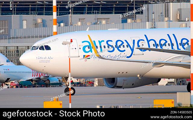 DUSSELDORF, GERMANY - JULY 21, 2017: Air Seychelles Airbus 330 S7-VDM taxiing to the start at sunset. Dusseldorf airport
