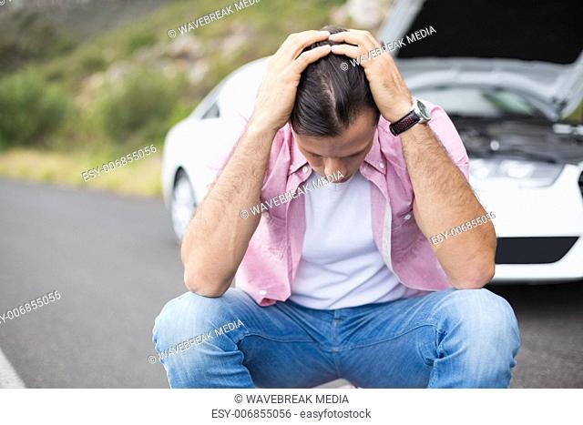 Stressed man after a car breakdown