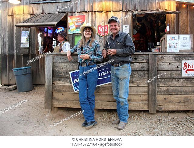 Roberta Ottmers and Bobby Burg stand at the bar in Luckenbach (Texas), USA, 19 March 2013. German is spoken in the middle of Texas