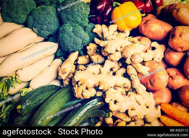 Vintage retro effect filtered hipster style image of Vegetables in Asian market close up, zucchini bell peppers (Capsicum), potatoes, ginger, broccoli cabbage