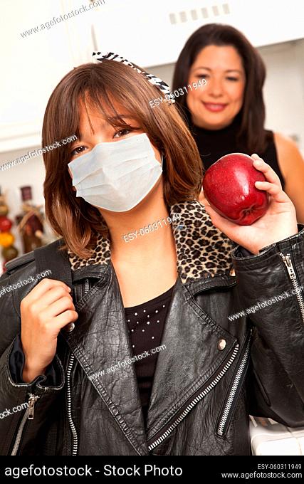 Young Hispanic Girl Student with Mother At Home Getting Ready For School Wearing Medical Face Mask