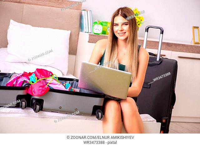 Young woman getting ready for summer vacation