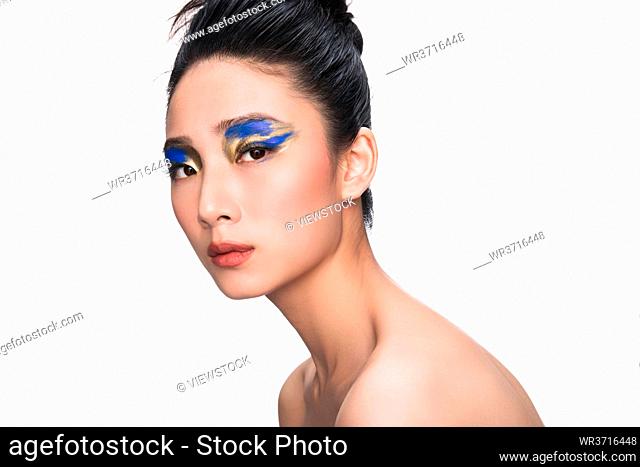 Blue and golden eye shadow beauty portrait
