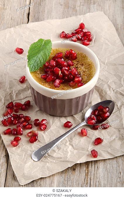 creme brulee with pomegranate seed and mint