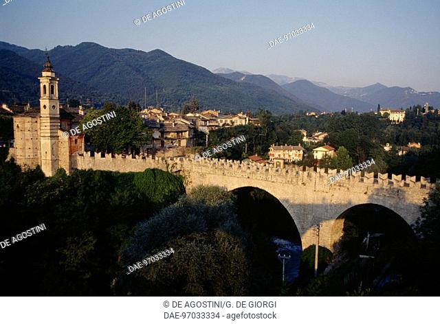 View of Dronero with the 15th century Old Bridge, known as the Devil's bridge, Piedmont, Italy