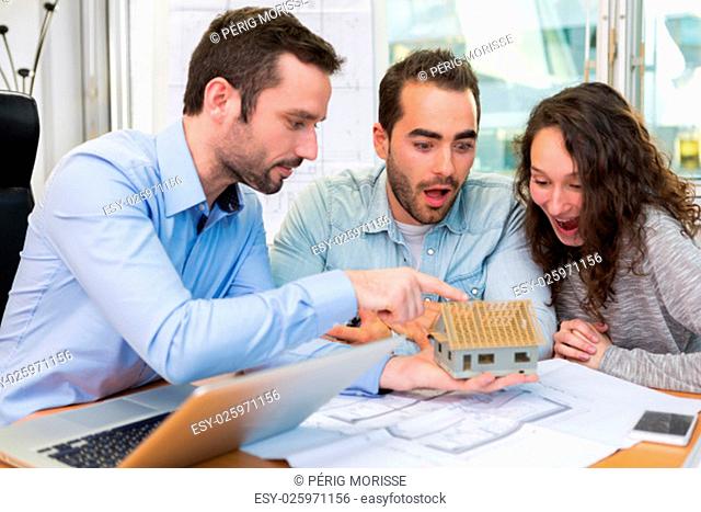 View of a Young attractive people meeting real estate agent at the office