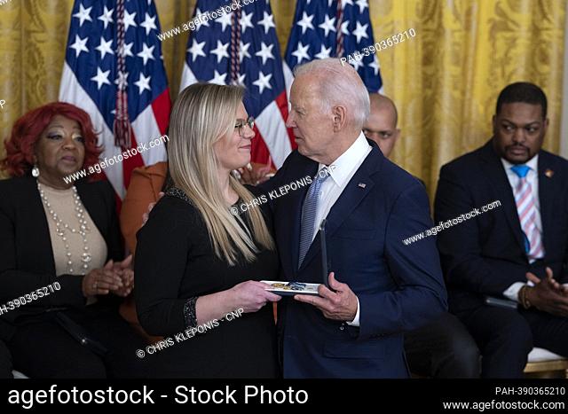 United States President Joe Biden presents the Presidential Citizens Medal posthumously to Erin Smith, the widow of Washington Metropolitan Police Department...