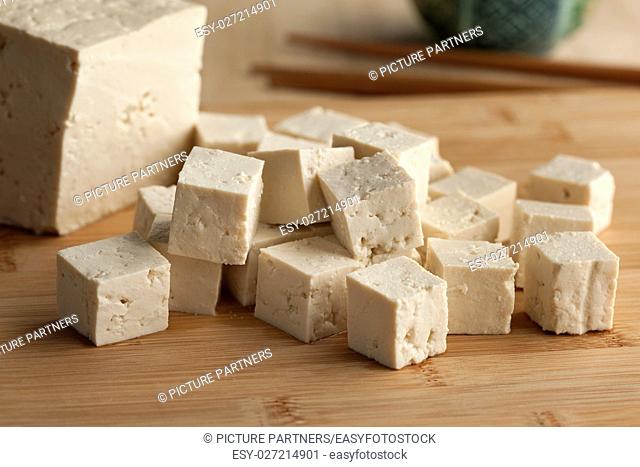 Fresh cut pieces of raw tofu