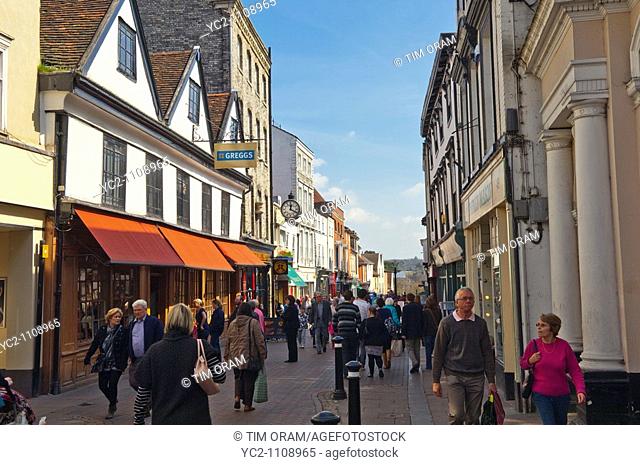 A street busy with shoppers in Bury Saint Edmunds , Suffolk , England , Great Britain , UK