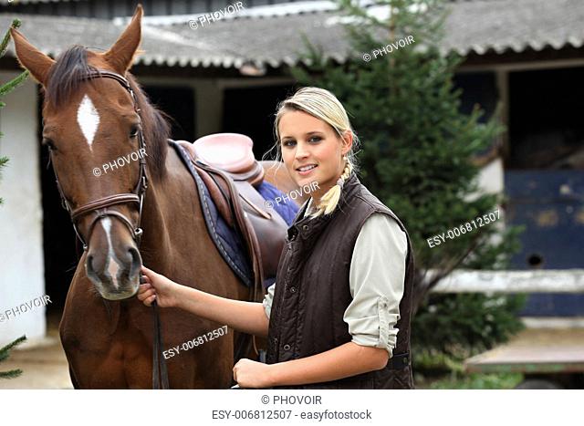 Blonde girl with horse