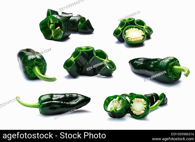 Set of immature whole and sliced Poblano peppers (Capsicum annuum), also called Ancho when ripe. New Mexico (Numex) chilies