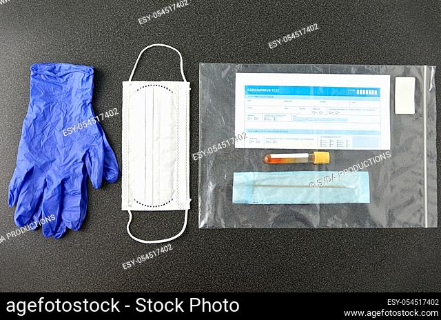 test tube, medical report, gloves and mask