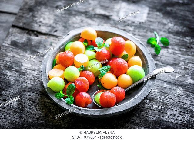 A bowl of colourful melon balls