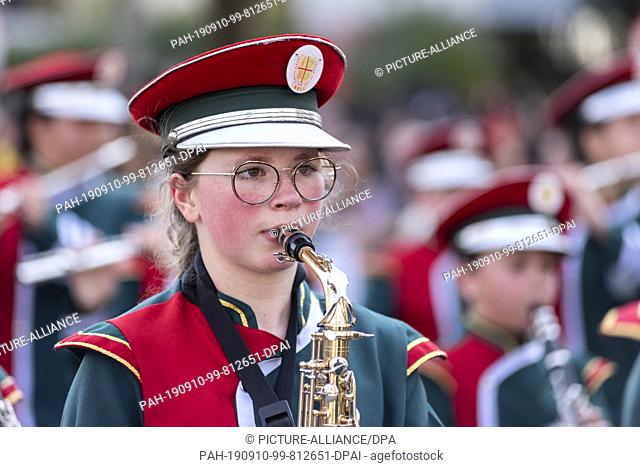 07 September 2019, Brazil, Curitiba: A girl from a marching band plays the saxophone during a parade to celebrate Brazil's independence