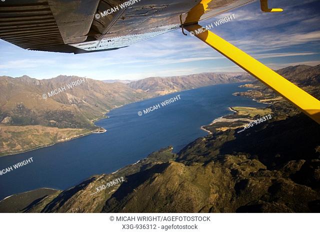 An aerial journey across the South Island into Milford Sound: Shotover River can be seen as well as various glaciers, emerald mountain top lakes