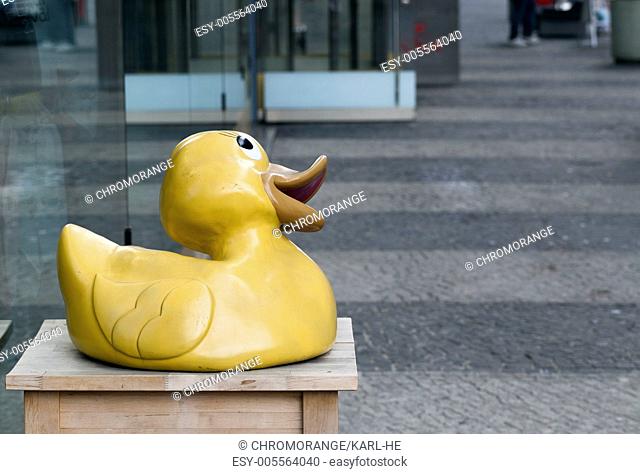 Rubber duck in front of shop windows