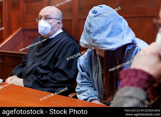 23 January 2023, Bavaria, Bayreuth: The accused 17-year-old young woman sits next to lawyer Wolfgang Schwemmer in the courtroom at the regional court