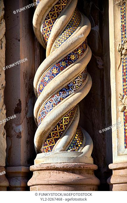 Close up of a medieval sculpted decotative twisting pillar on the14th century Tuscan Gothic style facade of the Cathedral of Orvieto, designed by Maitani