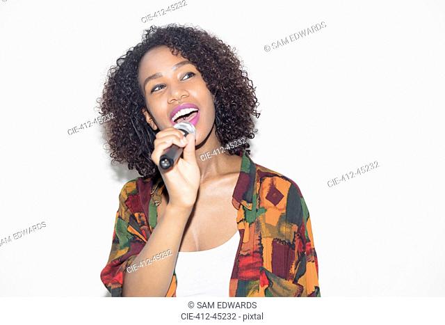 Woman with microphone singing