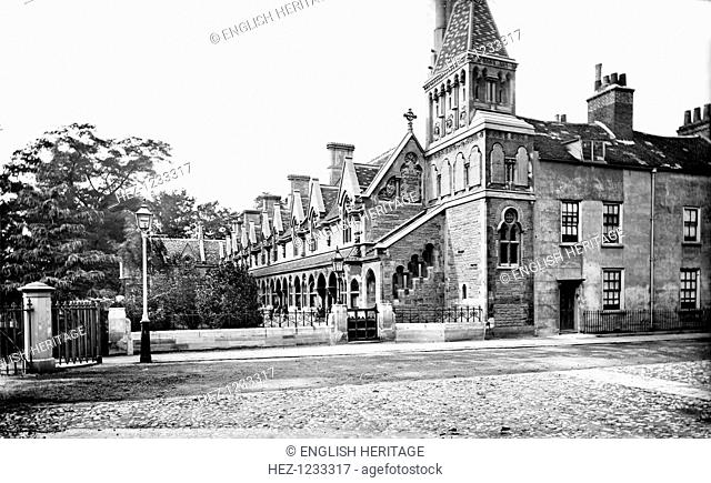 Powell's Almshouses, Fulham, London, c1860-1922. Powell's Almshouses, an L-shaped block with a tower to the west, founded in 1680 but rebuilt in 1869