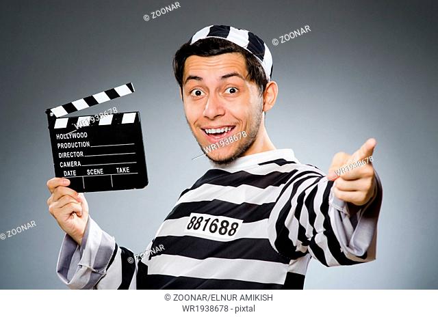 Inmate with movie clapper board