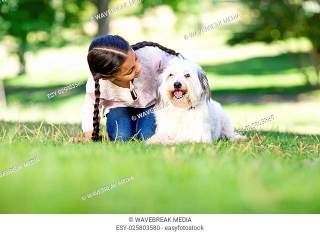 Girl playing with her pet dog