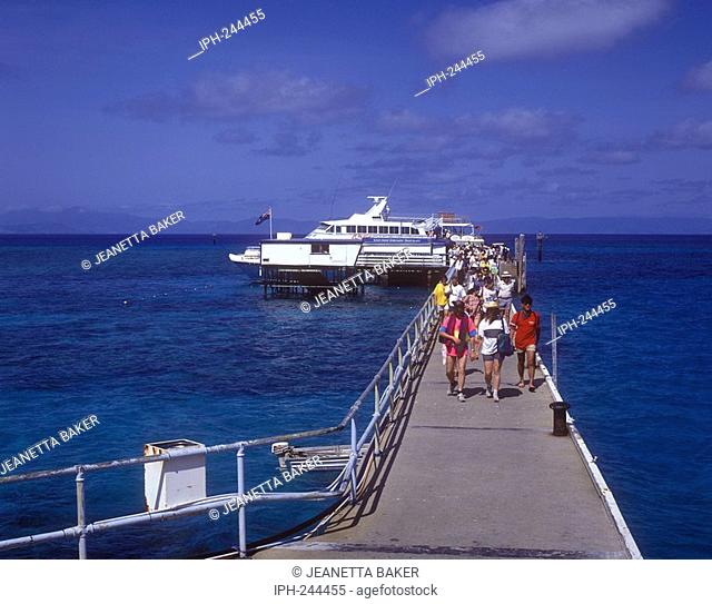 Tourists arriving to Green Island, a coral cay set within the Great Barrier Reef Marine Park near Cairns