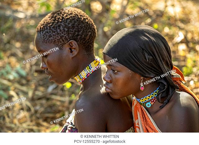 Close-up of two young Hadzabe women wearing colourful beaded jewelry near Lake Eyasi; Tanzania