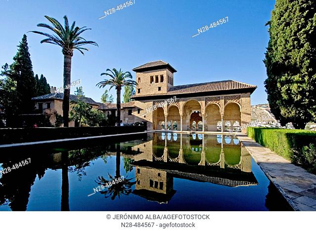Pond and Ladies Tower. Palacio Nazarí. Partal Gardens. Alhambra. Granada. Andalucia. Spain