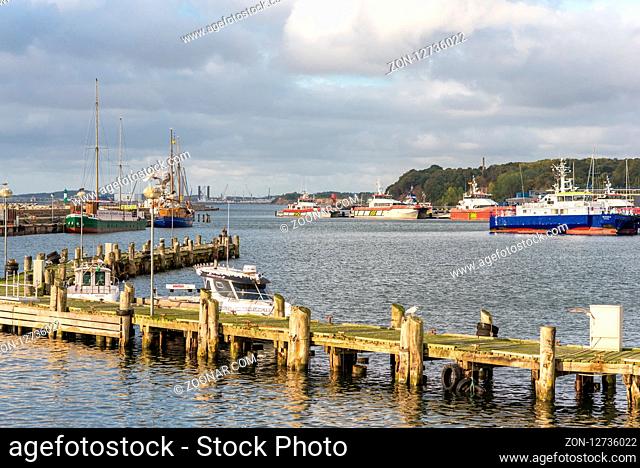 The old fishing port of the seaside resort Sassnitz with a lot of twin hull ships in the harbor