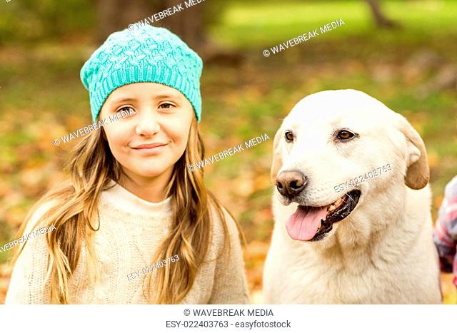 Smiling young girl with her dog