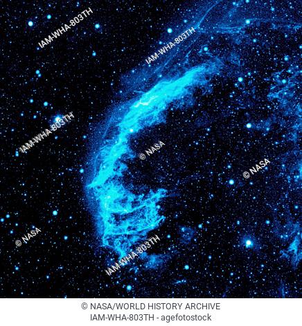 The Cygnus Loop nebula, taken by NASA's Galaxy Evolution Explorer. The nebula lies about 1, 500 light-years away, and is a supernova remnant