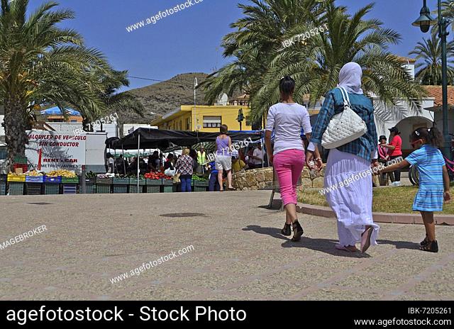 Muslim woman with child going to the market, Villaricos, Andalucia, Spain, Europe