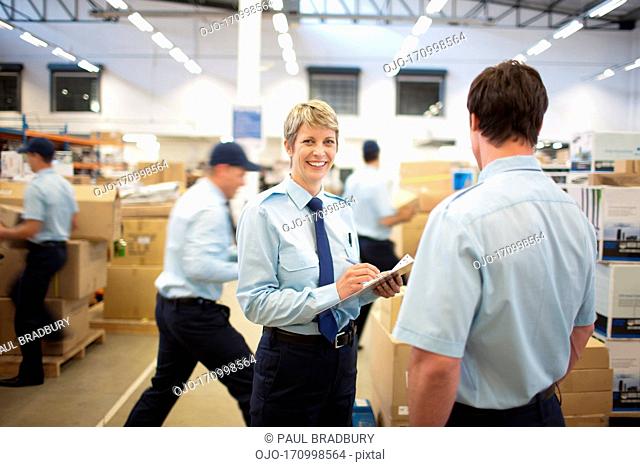 Worker standing near boxes in shipping area