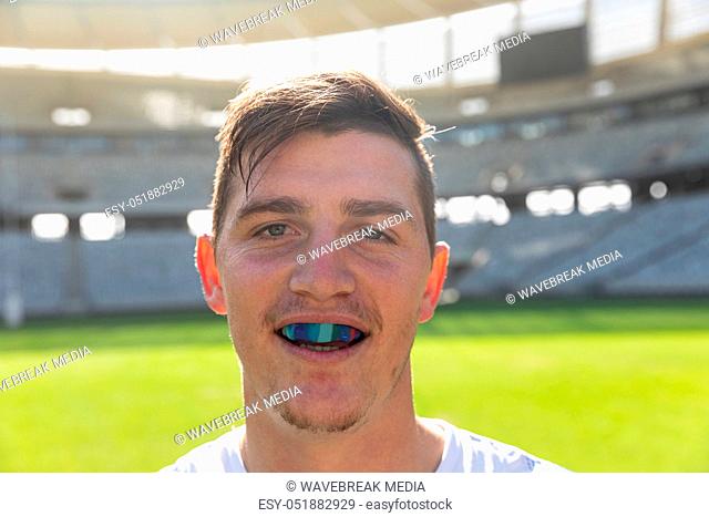Male rugby player with mouth guard in stadium
