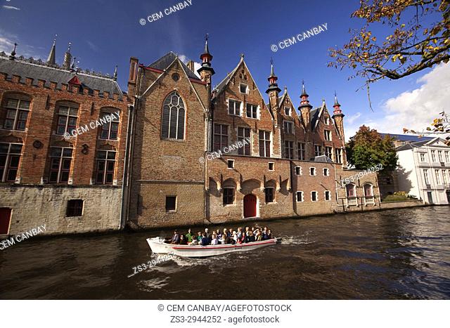 View to the people on the trip boat near the Rozenhoedkaai, Canal and Tower, Bruges, West Flanders, Belgium, Europe