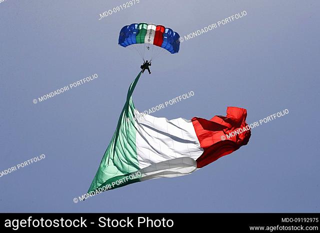 A paratrooper of the Army lands on Via dei Fori Imperiali with a tricolour flag during the celebrations for the Republic Day