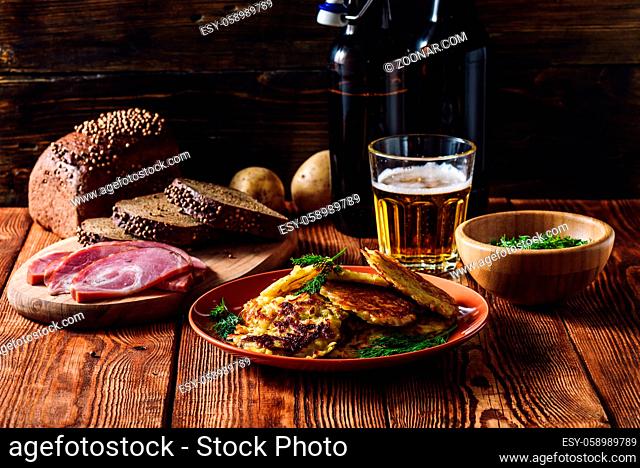 Glass of Beer with Potato Pancakes, Smoked Meat and Rye Bread