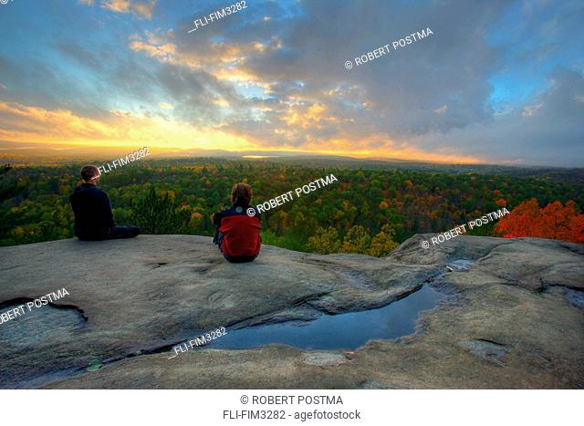 Hikers on Lookout Trail at Sunset in Autumn, Algonquin Park, Ontario