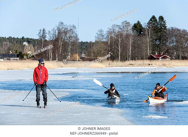 People kayaking and skiing